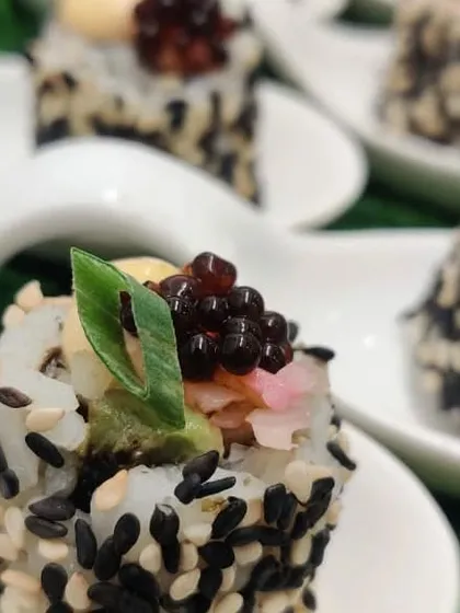 A close-up of our authentic sushi, crafted with the best ingredients. This is just one example of our diverse Asian menu, which includes everything from dim sum and baos to flavourful curries.