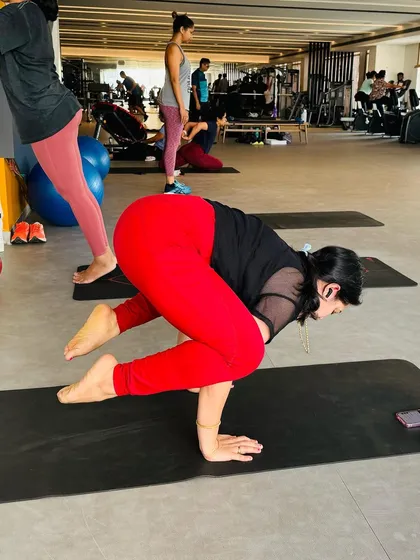 A side view of my Bakasana (Crow Pose) practice. This pose is a great teacher of how to distribute weight and engage the core to find lightness.