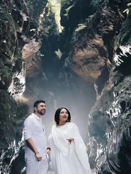 A wide shot showing the scale and beauty of the Robber's Cave location for a pre-wedding shoot.