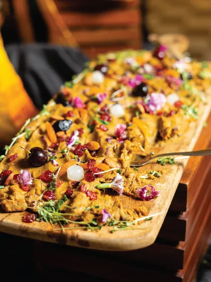 Our signature Haleem board, a rich and flavourful dish presented as a shared platter. It's a perfect centrepiece for a grazing table, encouraging guests to gather and enjoy together.