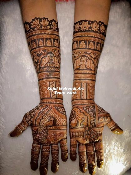 This is a full coverage bridal design created by my talented team. The patterns are consistent and flawlessly executed, showcasing our commitment to quality even on large orders.