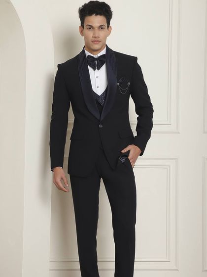 Some occasions demand a special designer tuxedo. This black tuxedo with a patterned waistcoat and bedazzled bow is for when you need to make a statement.