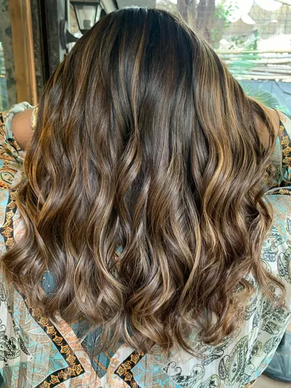 The final result of the 'Swirled Chocolate Butterscotch' color. The hair is glossy, multi-tonal, and looks incredibly healthy.