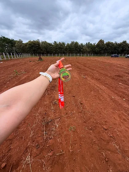 A shot of the medal against the backdrop of the race course. A reminder of the journey and the beautiful places running can take you.