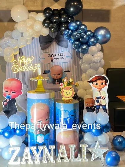A close-up of the Boss Baby setup, showing the details on the custom backdrop and the light-up name sign.