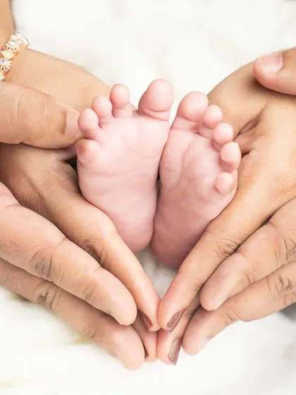Sometimes, the smallest details tell the biggest story. I love capturing these tiny feet, held so lovingly in their parents' hands, a reminder of how small they once were.