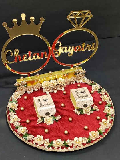 A beautiful ring engagement platter for Chetan and Gayatri, customized in a royal red and gold theme with their names.