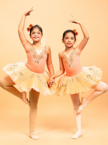 Our dancers are ready to grace the stage in 'The Waltz of the Flowers.' These photos capture their excitement and poise before bringing this timeless piece from The Nutcracker to life.