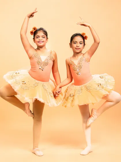 Our dancers are ready to grace the stage in 'The Waltz of the Flowers.' These photos capture their excitement and poise before bringing this timeless piece from The Nutcracker to life.