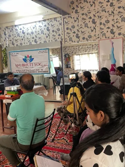 Participants at our Heart Wellness workshop listen attentively. We cover topics like managing blood pressure, improving circulation, and reducing stress through lifestyle changes and yogic practices.