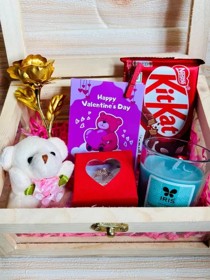 An open view of the mini Valentine's hamper, showcasing the golden rose, teddy bear, couple rings, and other charming gifts perfect for expressing your love.