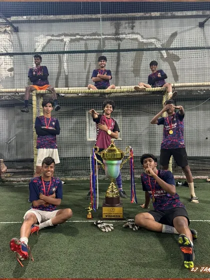 The victory pose. This U19 trophy was earned through teamwork and a powerful partnership.