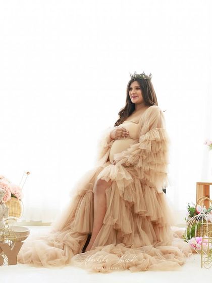 A bright and airy setup with "BABY" blocks and floral accents, creating a sweet and celebratory scene for the queen of the day.