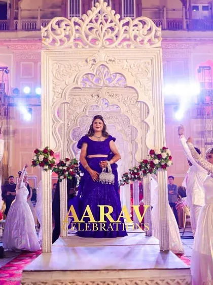 A beautiful shot of the bride's anniversary entry, with dancers in a celebratory pose. The entire setup is designed to create a picture-perfect moment of joy and grandeur.