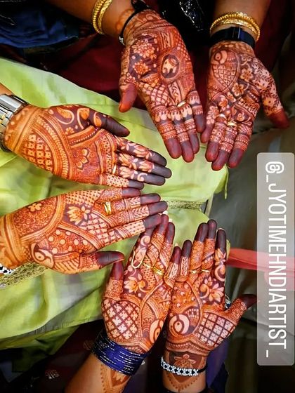A group photo showcasing the consistent, dark stains achieved by my team for a bridal party. We use the same high-quality organic henna for everyone.