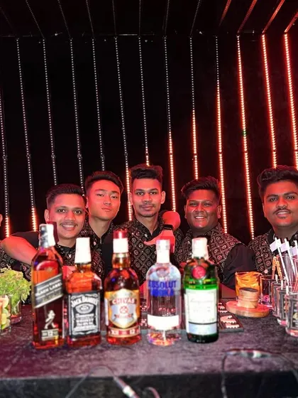 Our full bartending team, ready to serve at a neon-themed event. We ensure our staff's energy and professionalism match the vibrant atmosphere we create.