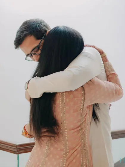 A warm, heartfelt embrace that says everything without a word. This photo captures the comfort and security two people find in each other, a simple and powerful expression of love.