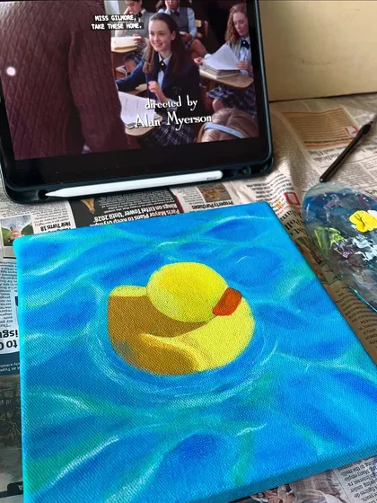 My ideal painting setup: a work-in-progress on the easel, my paint palette, and a good show playing in the background. This is my happy place.