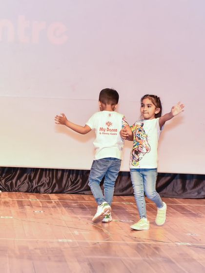 Anaira and a fellow dancer performing together, demonstrating the teamwork and coordination learned in our classes.