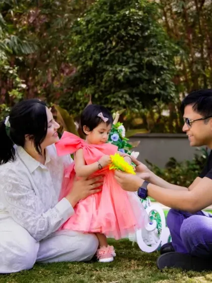A sweet family moment in the grass. Outdoor sessions allow for natural interaction and beautiful, light-filled portraits.