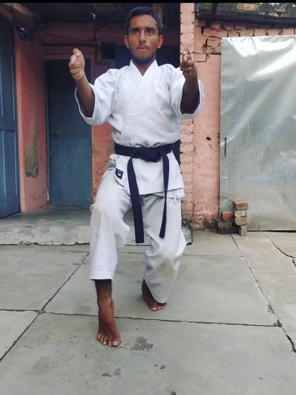 Practicing a one-legged stance, which is crucial for developing balance for advanced kicks and forms. Even simple training at home helps.