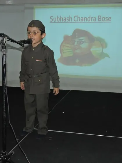 A student dressed as Subhash Chandra Bose delivers a speech. We encourage children to learn about and embody the spirit of our great national leaders.