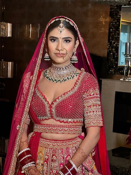 A classic bridal portrait, with the focus on the bride's radiant look and neat hairstyle.