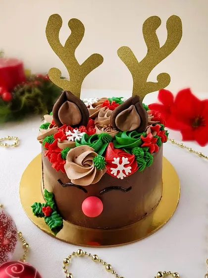 'Tis the season to be jolly with my adorable and festive Reindeer cake. It's a classic chocolate truffle cake coated with creamy chocolate mousse and decorated with Christmas-colored buttercream.