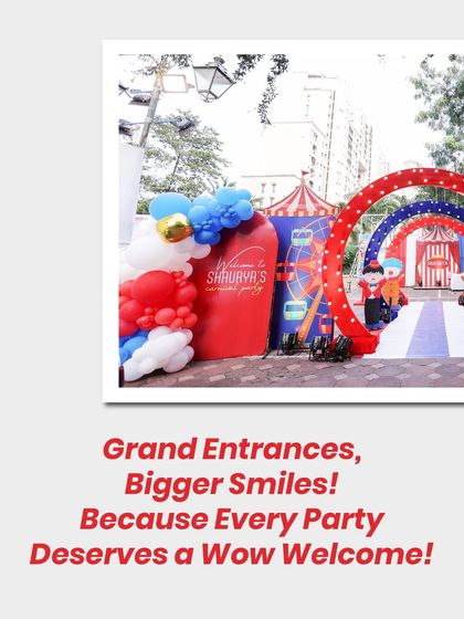 Grand entrances lead to bigger smiles! This circus-themed welcome area with red and white arches and balloon clouds creates an exciting pathway into the main event.
