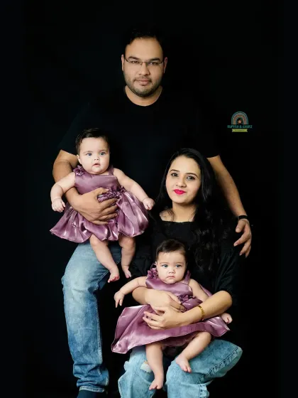 A beautiful pose with parents and their twin daughters. We guide you into natural poses that feel comfortable and result in stunning family photos.