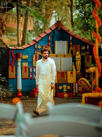 A stylish portrait of the groom at the beautiful outdoor venue of the Mantra Mangalya.