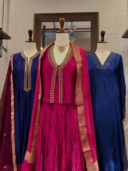 A full view of the elegant blue and pink ethnic wear, perfect for pujas or family gatherings.