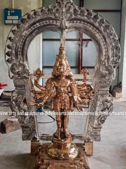 A work-in-progress view of a Panchamukhi Hanuman sculpture. The bronze idol is placed within its silver-plated Prabhavali (arch), showing how we combine different metals and elements in our work.