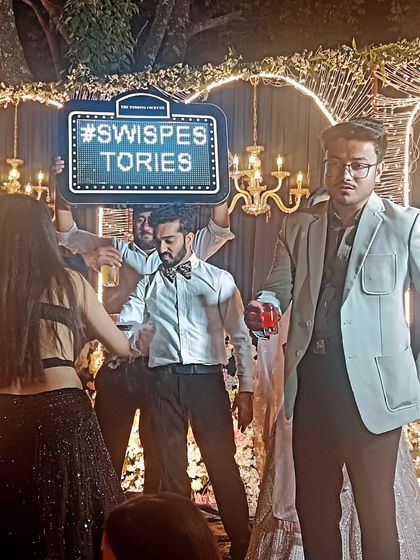 My team members become part of the celebration, holding up custom hashtag signs and ensuring the bar area is the most exciting spot at the event.