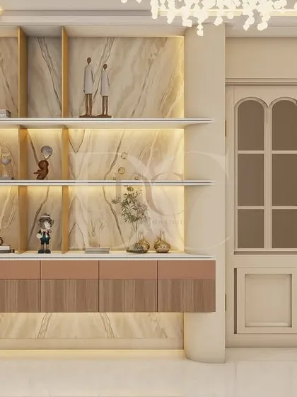 This display unit features a marble-clad back panel with integrated lighting. It’s a perfect example of how we turn functional storage into a beautiful decorative feature in a living or dining room.