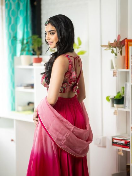 Showing the back design of the blouse. Every detail matters when choosing an outfit for an event.