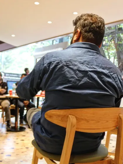 A view from behind the author, showing his perspective of the engaged and curious audience during the "Paper Bullets" book reading.