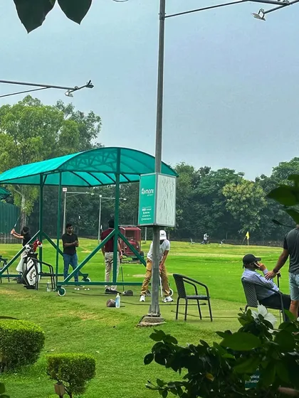 A range bucket is always a better choice than a Netflix binge. Golfers enjoying a weekend session.
