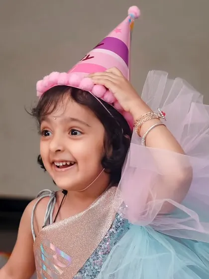 The pure, uninhibited joy of a birthday girl enjoying her party. Our candid photography aims to freeze these fleeting, happy expressions.