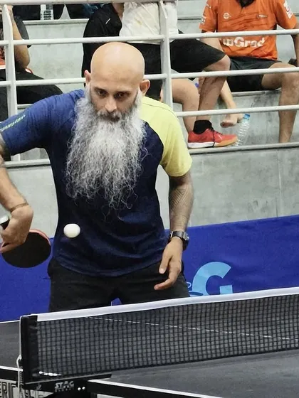 Passion for table tennis is timeless. We offer specialized coaching for veteran and corporate players, focusing on strategy, fitness, and competitive play. This player demonstrates intense focus during a match at the Indian Table Tennis League, proving it's never too late to compete.