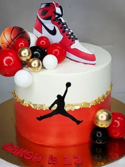 A stylish cake for a basketball fan, featuring the iconic Jordan logo and sneaker. This is an eggless black forest cake, perfect for a 13th birthday.