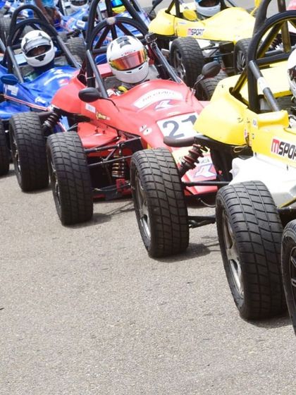 A close-up of the packed starting grid, capturing the tension and anticipation before the lights go out.