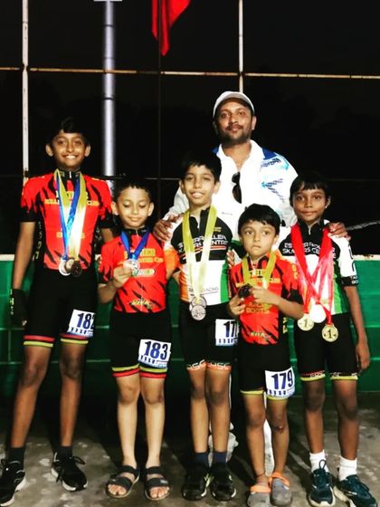 Here are some of our proud medal winners from the Open district competition. It's always a joy to see them with their coach, celebrating their achievements as a team.