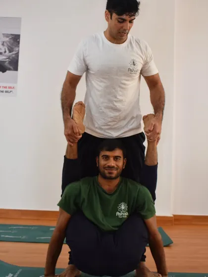 This partner stretch helps to open the hips and hamstrings. It's a great example of how we use teamwork in our TTC to achieve poses that might be difficult to access alone.