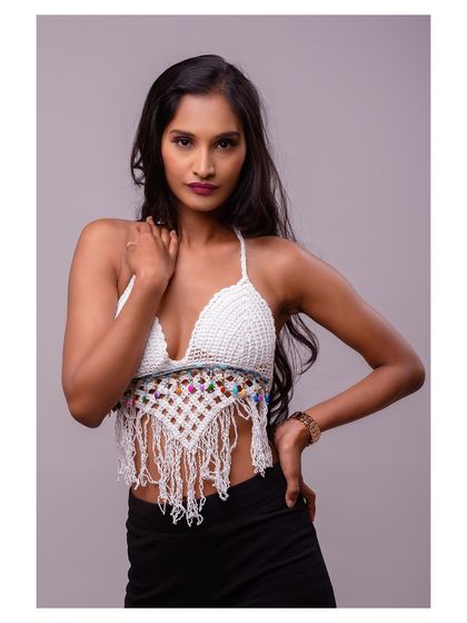 A confident, hands-on-hips pose that clearly displays the front of the top.