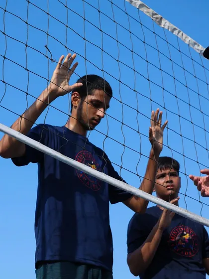 I provide real-time feedback on a player's blocking stance. Direct, individual correction helps our athletes build the right muscle memory from the start.
