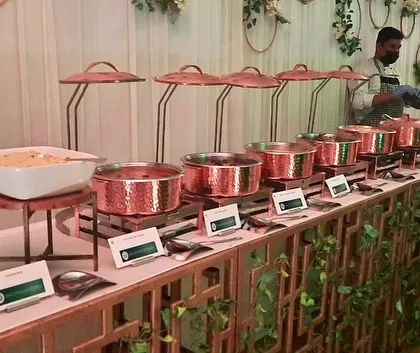 A full view of the elegant copper serveware and decorative setup for a Diwali event.