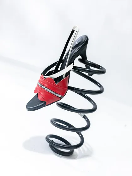 Another angle of our spring prop, this time focusing entirely on the shoe. This highlights the product in a unique, conceptual way.