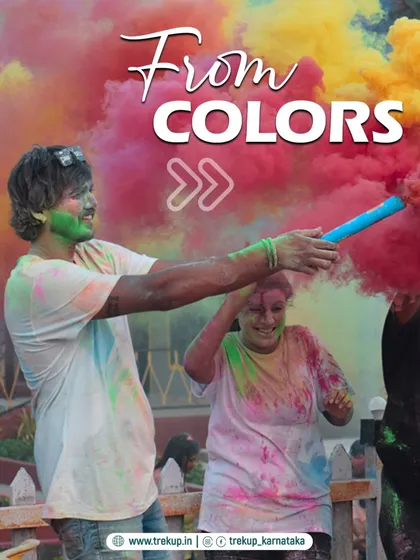 The joy of Holi. A participant throws colored powder in the air during our special event in Dandeli.