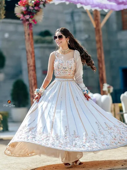 The bride, Sahiba, twirling in her beautiful white lehenga during her Mehendi ceremony. We love capturing these graceful, happy moments that showcase the bride's outfit.
